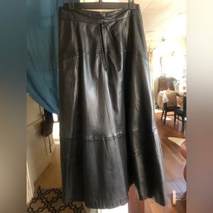 Black leather skirt, size 12, 38”.  Diagonal slit pockets.